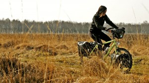 Ivana cycling through the Dutch heather on her Santos Travelmaster